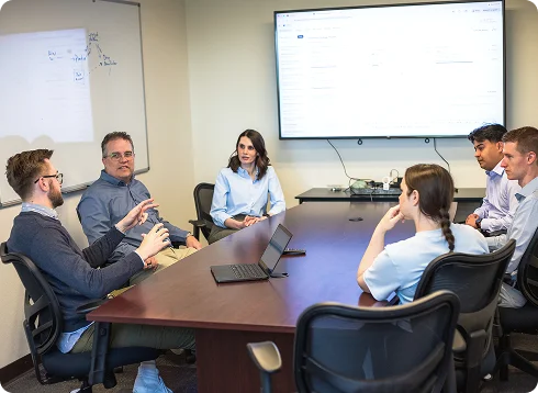 Ladderly team members meeting in a conference room